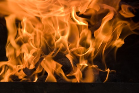 Hot flames from a burning charcoal fire.の写真素材