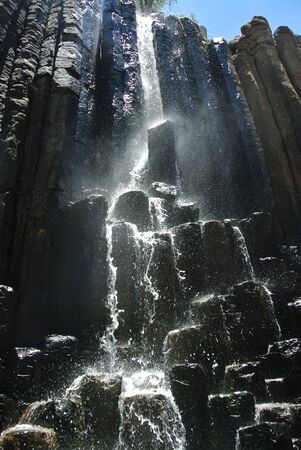Waterfall of basaltic prisms