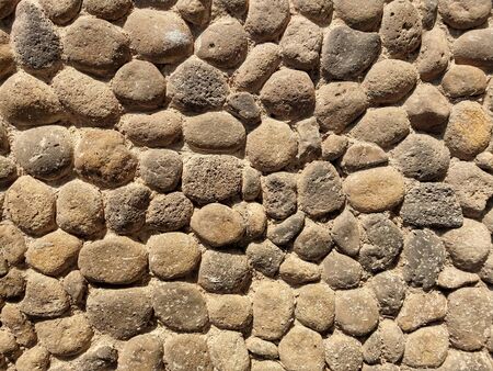 Wall formed with many stonesの写真素材