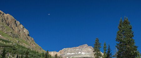 Panoramic of Trees, Moon and Mountains on Camp Bird Road, Yankee Boy Basin and Mount Sneffels Wilderness, Ouray, Coloradoの写真素材