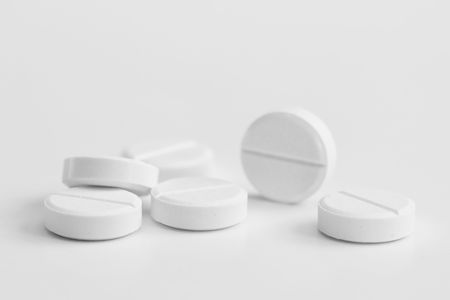 Stack of pills isolated on white backgroundの写真素材