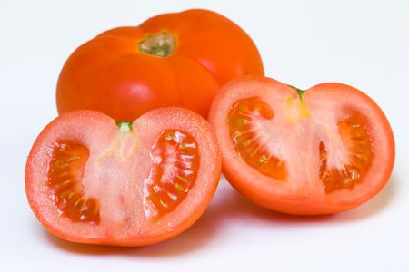 Ripe red tomatoes on a white backgroundの写真素材