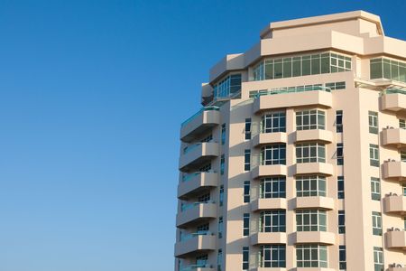 Newly completed high rise condominium buildings against blue sky