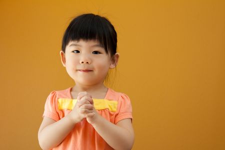 Portrait of a little Asian baby child girlの写真素材