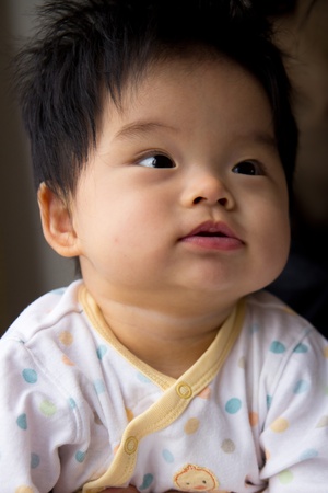 Portrait of a little Asian baby girlの写真素材