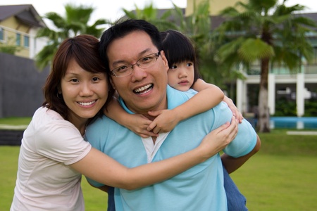 Happy family portrait at outdoor, smile and looking into cameraの写真素材
