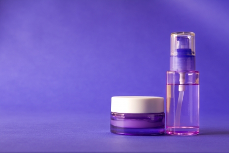 Purple cosmetic and beauty products on purple backgroundの写真素材