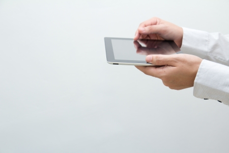Close up shot of a business man holding a tablet PCの写真素材