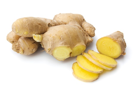 Ginger with a few slices isolated on white backgroundの写真素材