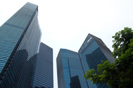Highrise corporate buildings in perspective with sky