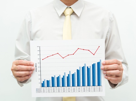 Man holding a business financial graph and chartの写真素材