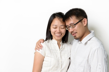 Asian couples with eye close isolated on white backgroundの写真素材