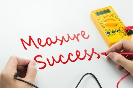 Measure of success conceptual using digital multimeterの写真素材
