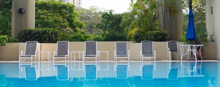 Luxury resort hotel swimming pool with sun loungersのeditorial素材