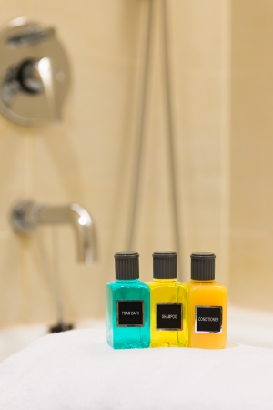Foam bath, shampoo and conditioner in hotel bathroomの写真素材