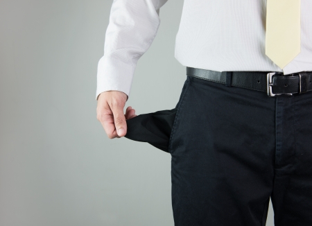 Close-up of a man showing empty pocketの写真素材