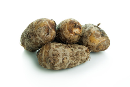 Close-up of taro root isolated on white backgroundの写真素材