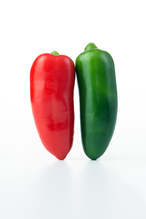 Red and green jalapeno hot peppers isolated on white backgroundの写真素材