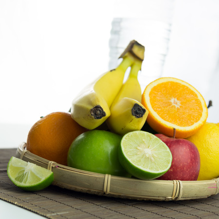 Group of mixed fruit on bamboo basketの写真素材