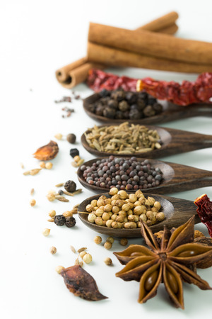 An assortment of different spices for cookingの写真素材