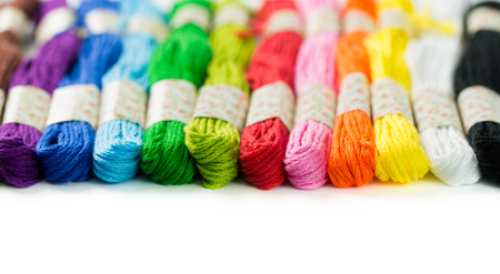 Colorful embroidery thread isolated on white background