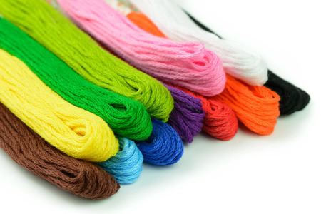 Colorful embroidery thread isolated on white backgroundの写真素材