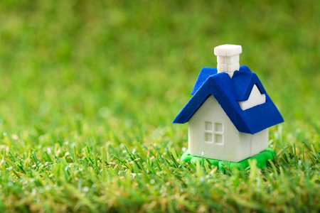 Close up of miniature house on green grassの写真素材