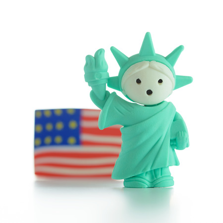 Miniature Statue of Liberty with US flagの写真素材