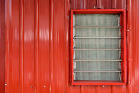 Window on a beautiful and textured wallsの写真素材