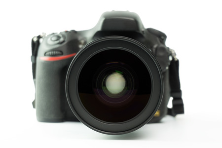Professional black DSLR camera over white background