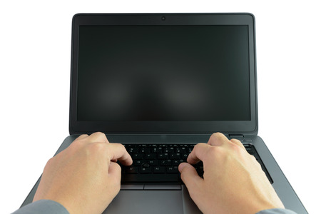 Close up of hand typing and working on laptop computerの写真素材