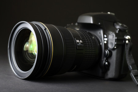 Professional DSLR camera with focus on lensの写真素材