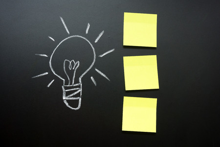 Hand drawn light bulb with plain notesの写真素材