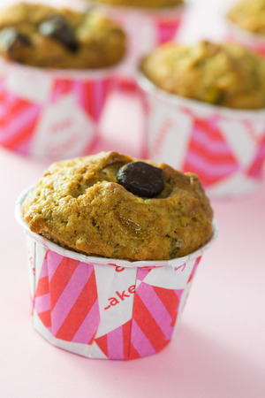 Close up of chocolate chip muffins on white backgroundの写真素材