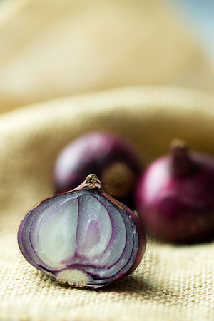 Close up of fresh shallots on gunny sackの写真素材