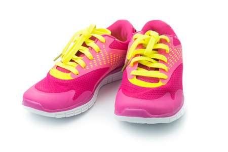 Pair of pink sport shoes on white backgroundの写真素材