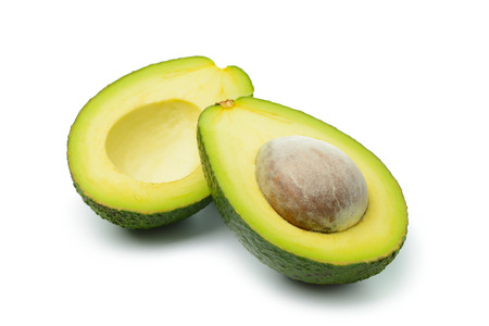 Fresh avocado in halved on white backgroundの写真素材