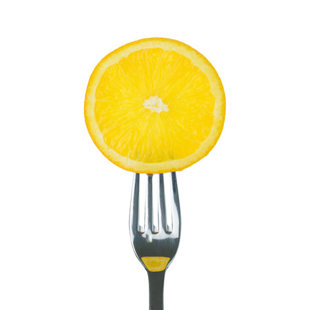 Fresh lemon on fork over white backgroundの写真素材