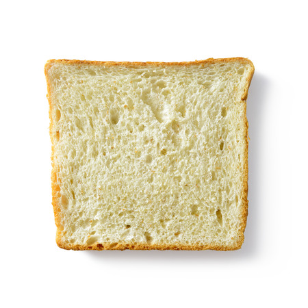Slice of whole wheat bread on white backgroundの写真素材