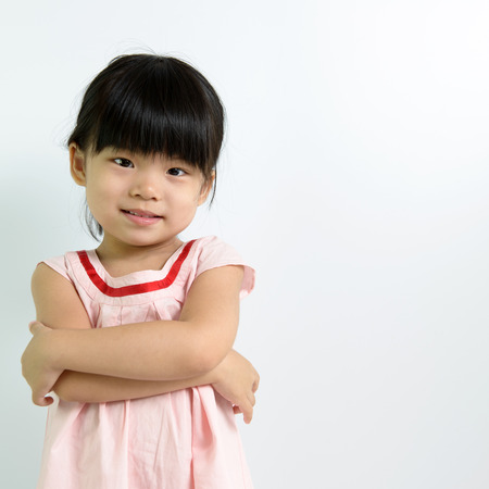 Portrait of little Asian child on white backgroundの写真素材