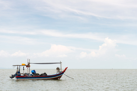 Fisherman boat against cloudy blue sky in Penang Malaysiaの写真素材