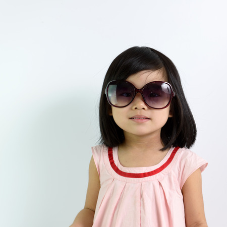 Portrait of little Asian girl wearing sunglassesの写真素材