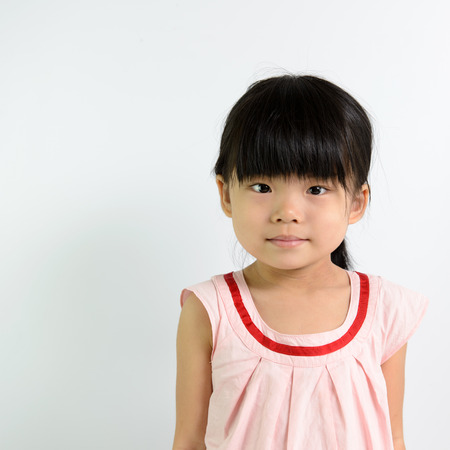 Portrait of little Asian child on white backgroundの写真素材