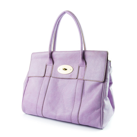Purple color lady handbag isolated on white backgroundの写真素材