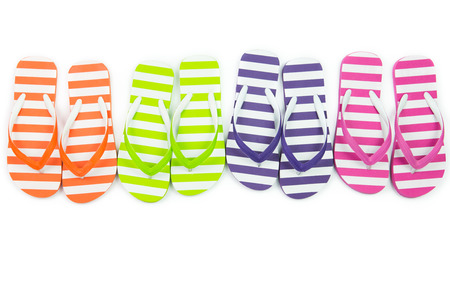 Multicolor striped flip fliops on white backgroundの写真素材