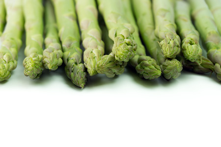 Close up of fresh asparagus on white backgroundの写真素材