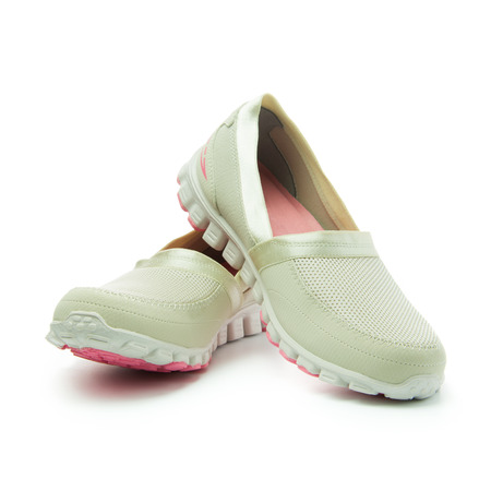 Pair of comfortable casual sneakers on white backgroundの写真素材