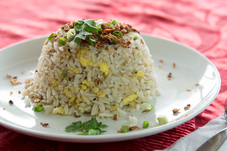 Chinese style fried rice served on white plateの写真素材