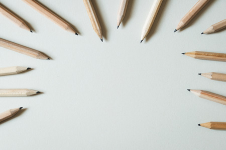 Close up of wooden pencils scattered on white backgroundの写真素材