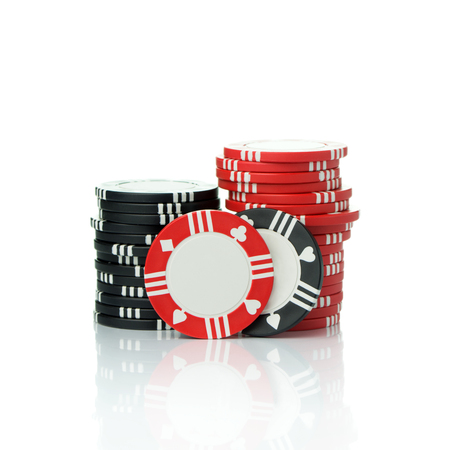 Stacks of casino chips isolated on white backgroundの写真素材